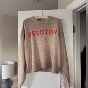 Peloton Women's Beige Sweater with Red Logo